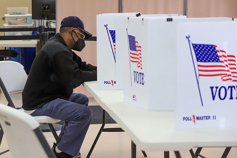 Staff photo by Olivia Ross | Chattanooga Times Free Press / A voter fills out their ballot at the Hamilton County Election Commission on Nov. 3, 2022. Tennessee had the lowest voter turnout in 2022, according to MIT data.